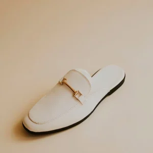 White lather loafer mules shoes on beige